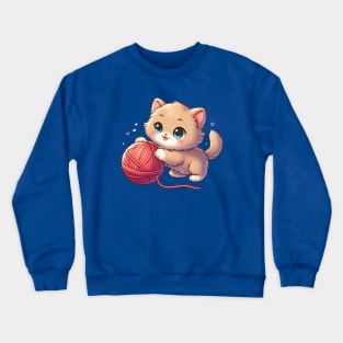 Adorable kitten playing with a ball of yarn Crewneck Sweatshirt